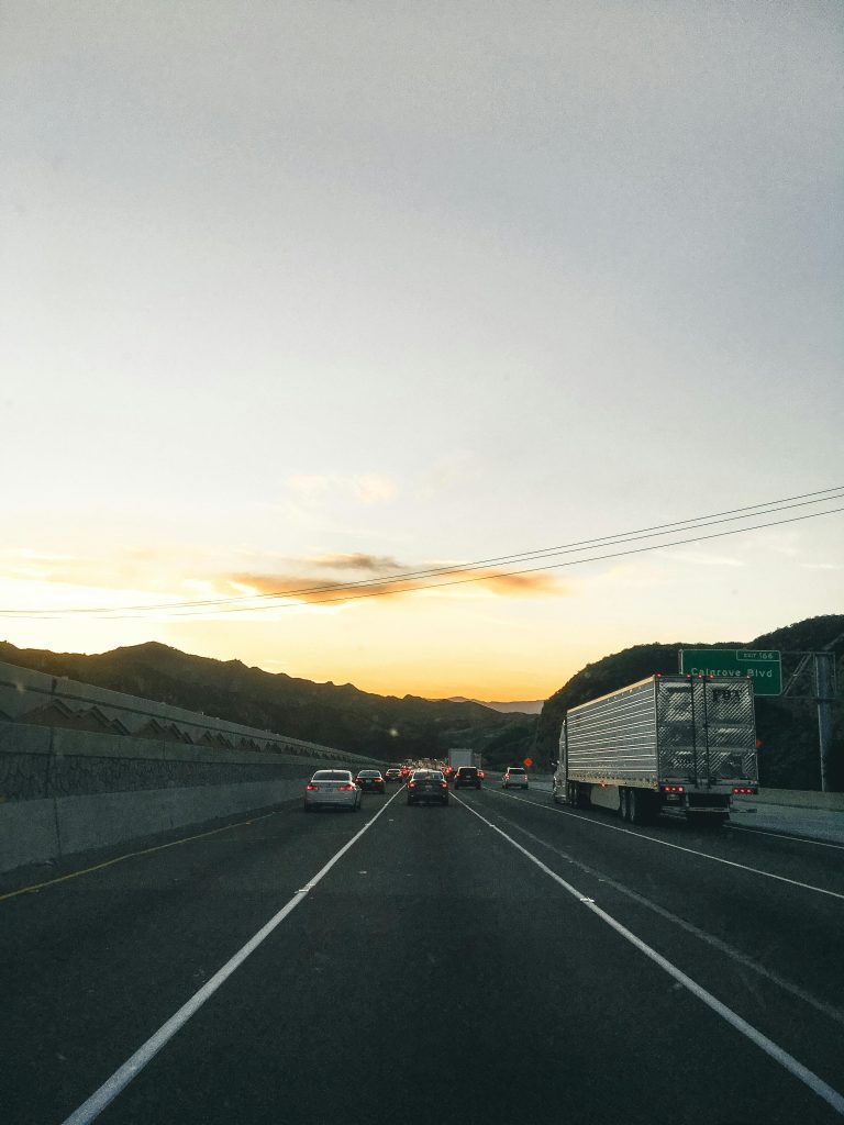 Vehicles on Road During Golden Hour